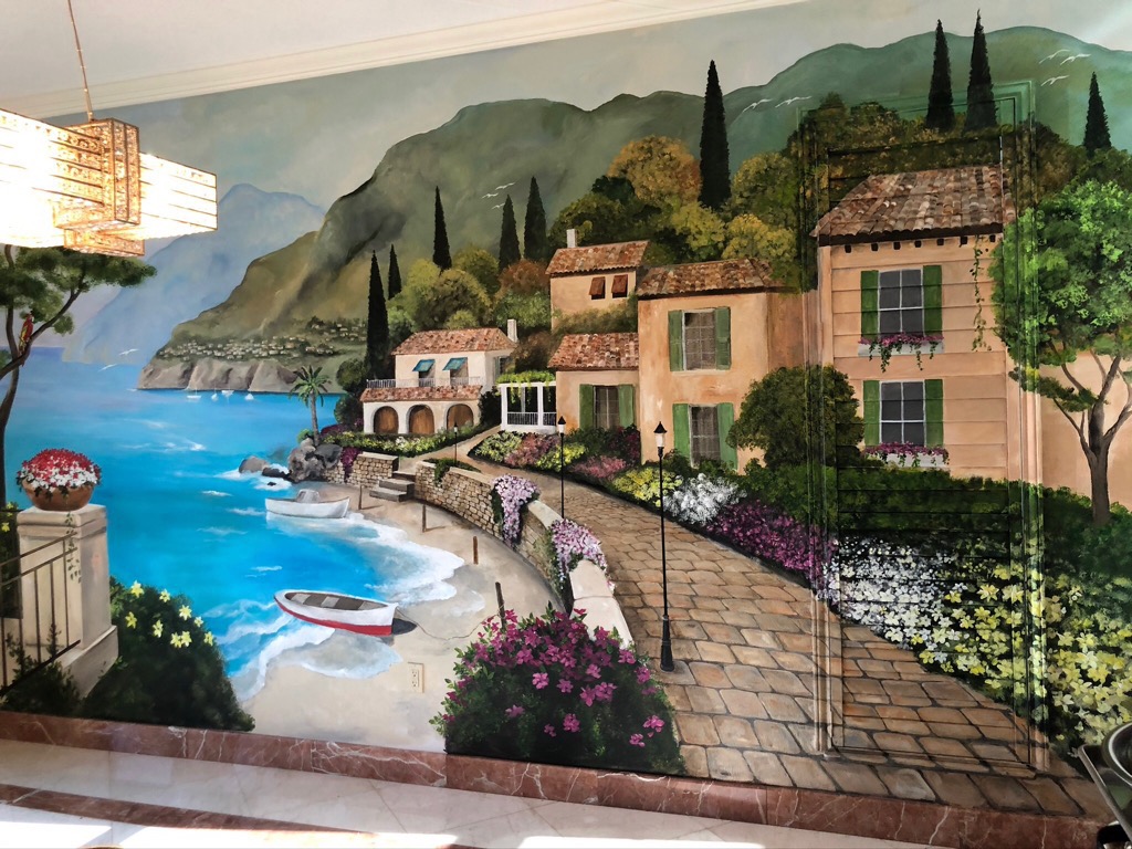 Mural of houses on brick path